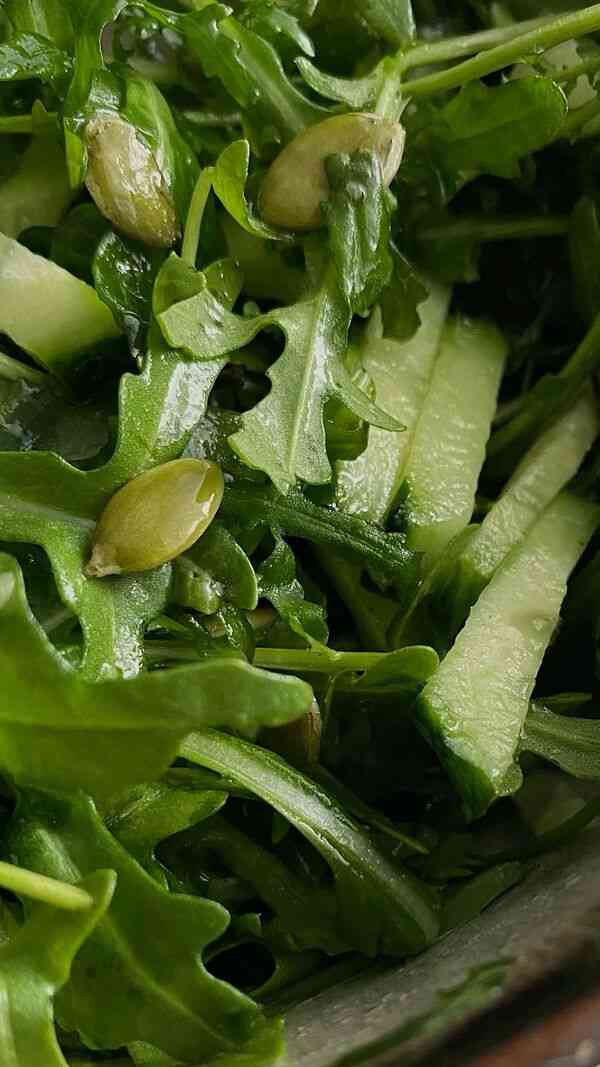 Colourful salad with leafy greens, vegetables and grains